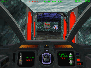 The player's ship's cockpit in Descent II, looking through this mine's red door towards the reactor, with some enemy robots visible. The colours are bright, text relatively large and the resolution low.