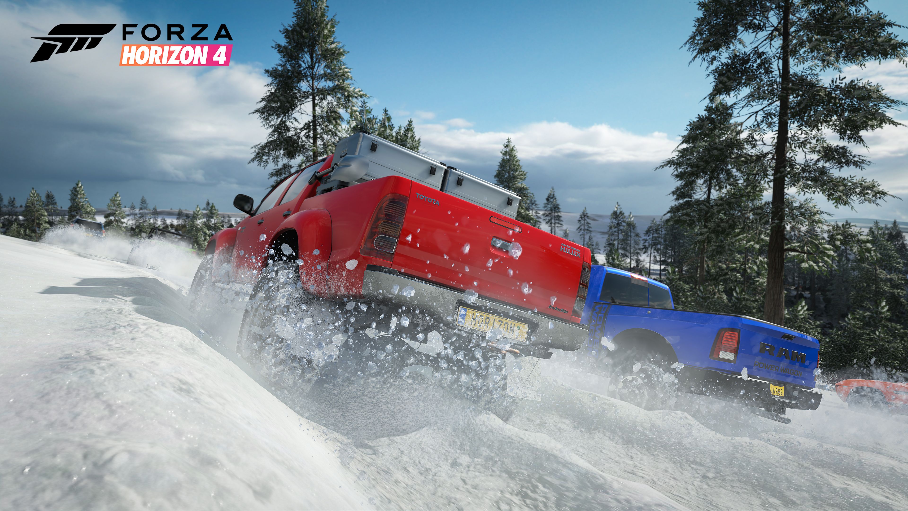 A red and a blue pickup truck tearing together through the snow in a forest, seen from behind, with snow being kicked up by the tires.