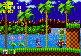 Sonic the Hedgehog begins his historic adventure in the bright and colourful Green Hill Zone, with verdant banks, deep blue lakes, palm trees, some power rings and an enemy on-screen.