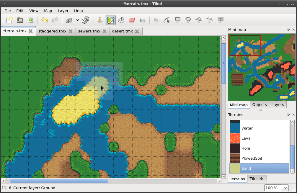 A cross-platform 2D top-down tile-based terrain editor, with a main view for laying tiles in detail, a 'mini-map' pane providing an overview of the map, tile selection swatch, and toolbar.